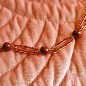 New goldtone with red crystal paperclip necklace with red jasper bead stations